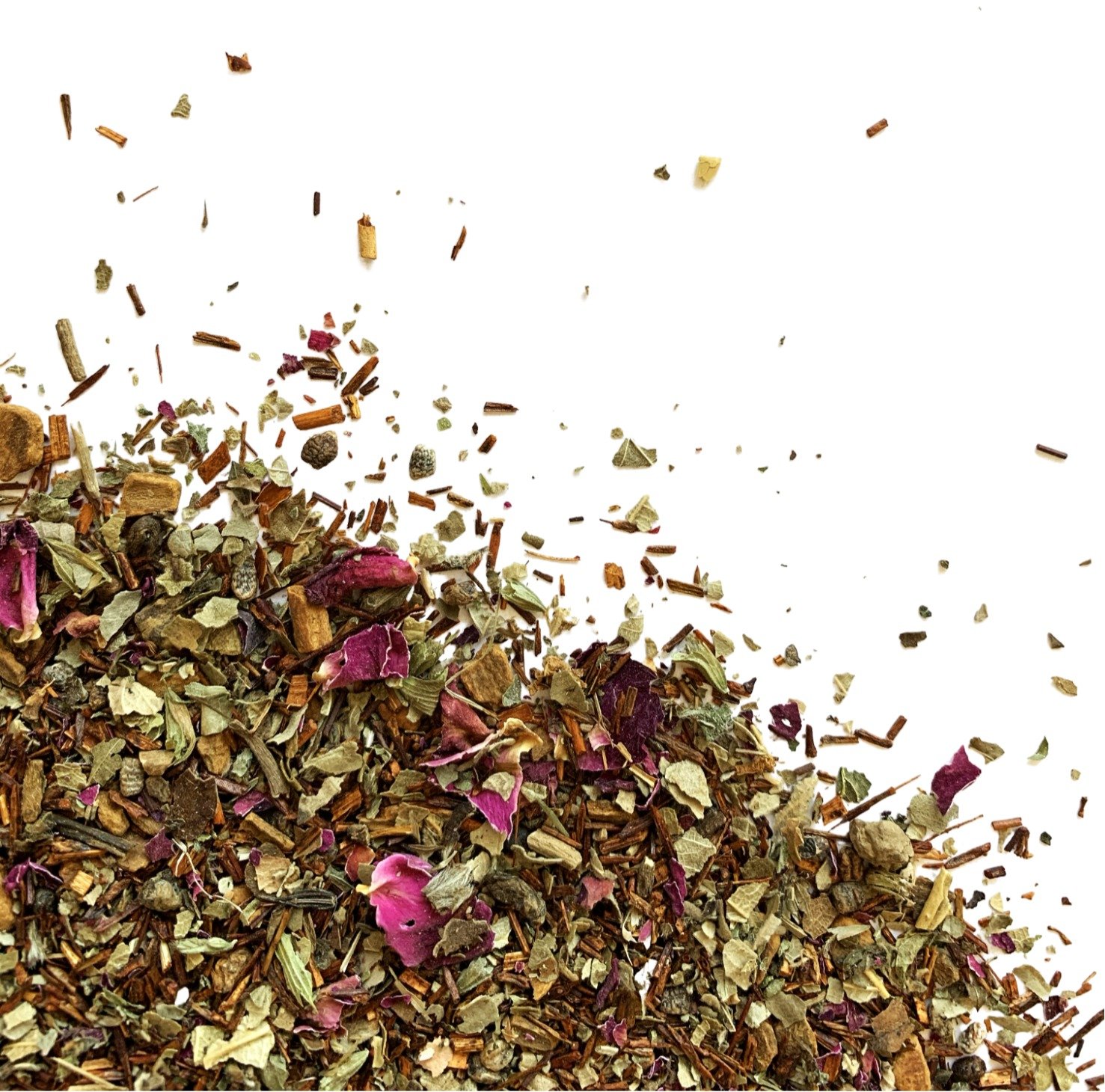 Rooibos Dream loose leaf tea blend with rooibos, rose petals, and spices visible