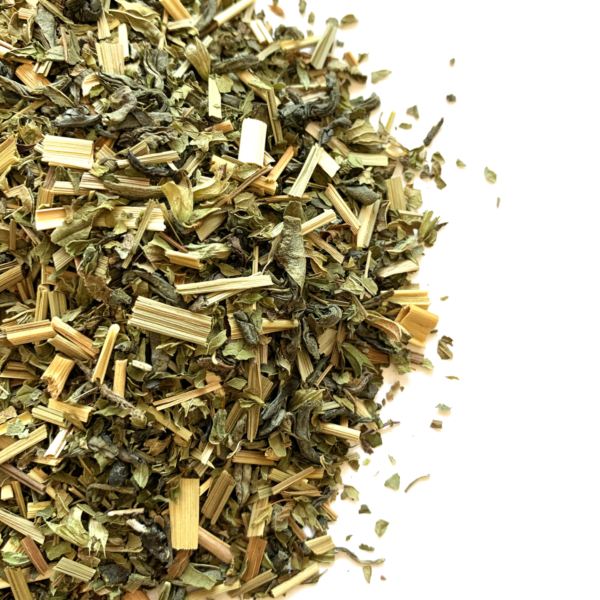 Tranquil loose leaf green tea blend with spearmint and lemongrass visible